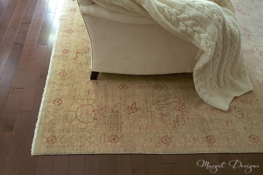 Hardwood floor with area rug.